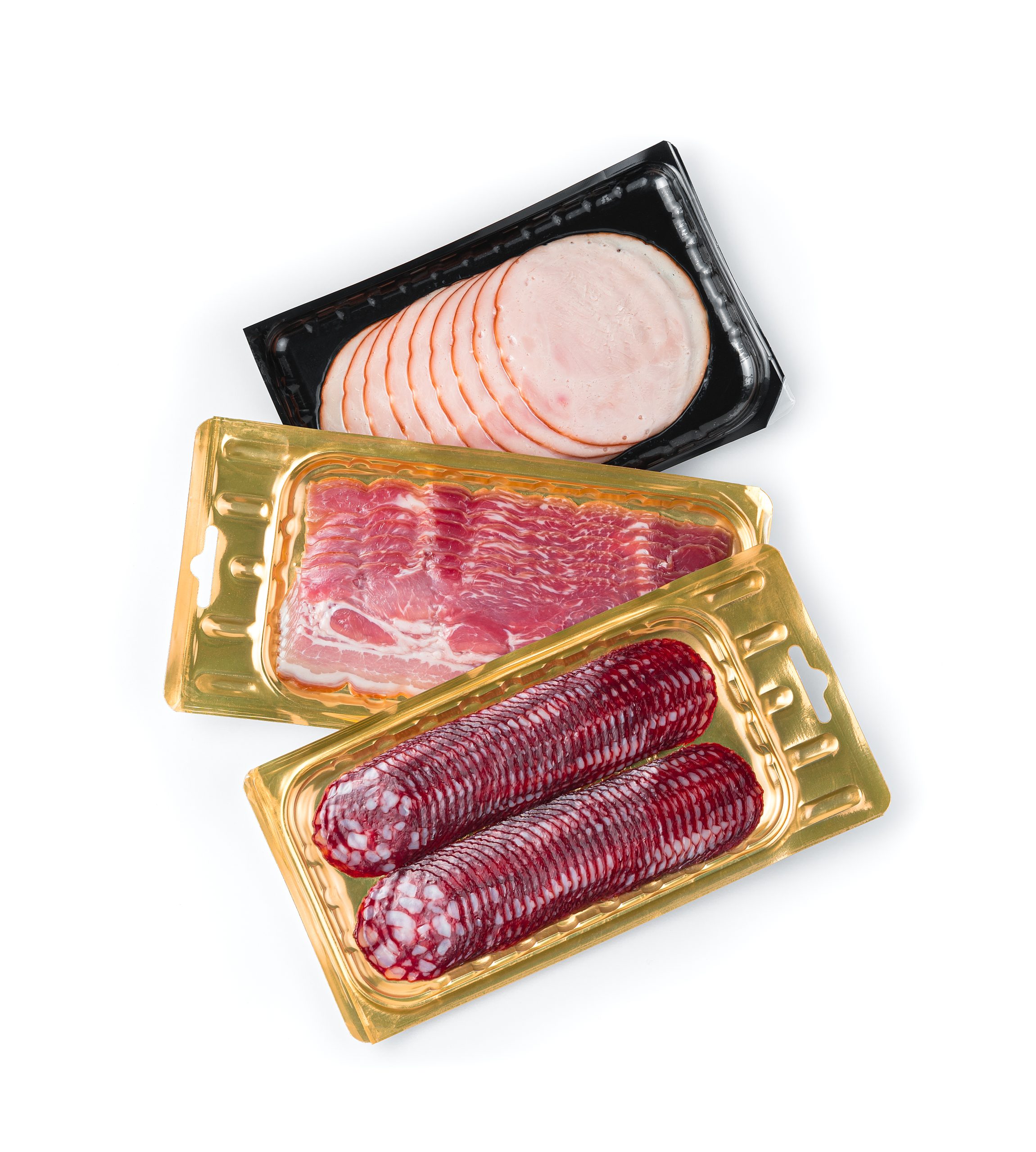 Three types of sausages and ham in vacuum packaging isolated on a white background. Top view.